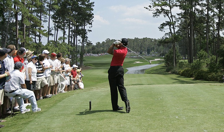 Tiger Woods tees off on the fourth hole during the final round of the 2009 Players Championship.
