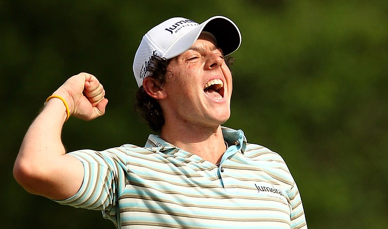 Rory McIlroy celebrates as he holes a birdie putt on the 18th green to win the Quail Hollow Championship.