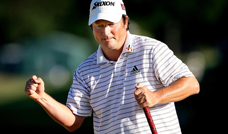 Tim Clark reacts after making a par putt on No. 18 at TPC Sawgrass on Sunday.