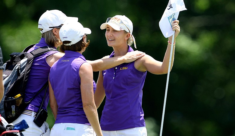 LSU's Megan McChrystal is greeted by Tigers head coach Karen Bahnsen and assistant Golda Johansson Borst.