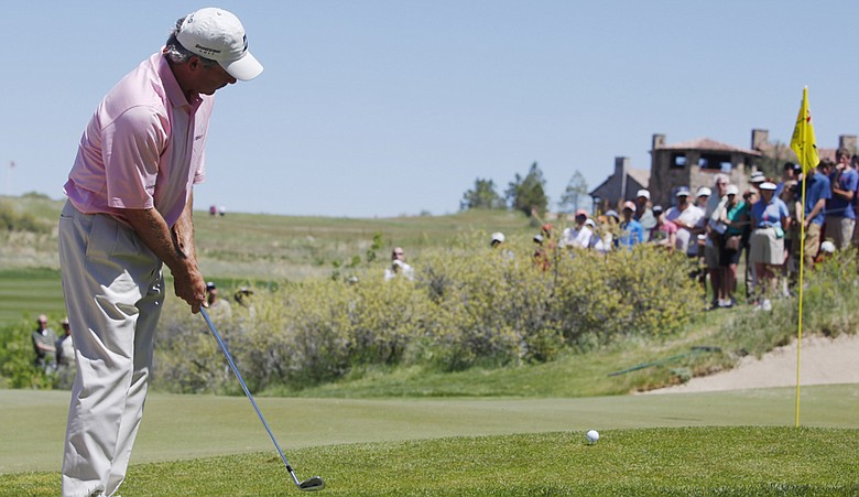 Fred Couples hits a chip shot at Colorado Golf Club during the 2010 Senior PGA Championship.
