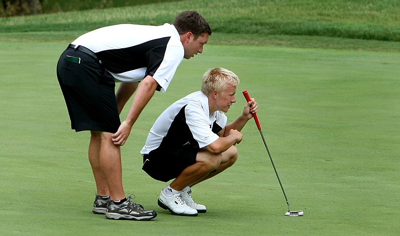 Baylor's interim assistant Ben Wright (left) Joakim Mikkelsen line up a putt during Round 1 at the NCAA Championship.