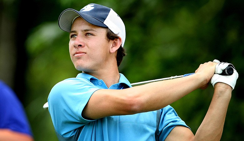 Alex Ching hits a shot during the third round of the NCAA Championship.