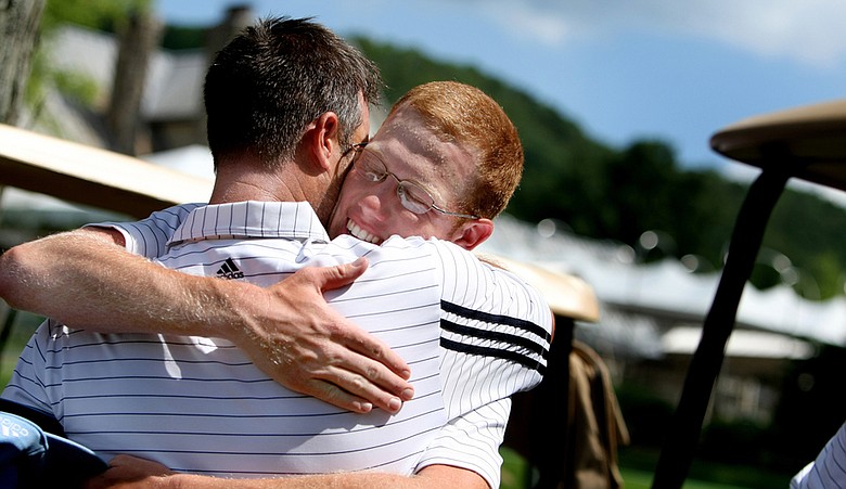 Augusta State's Carter Newman hugs head coach Josh Gregory after Saturday's semifinal win over Florida State.