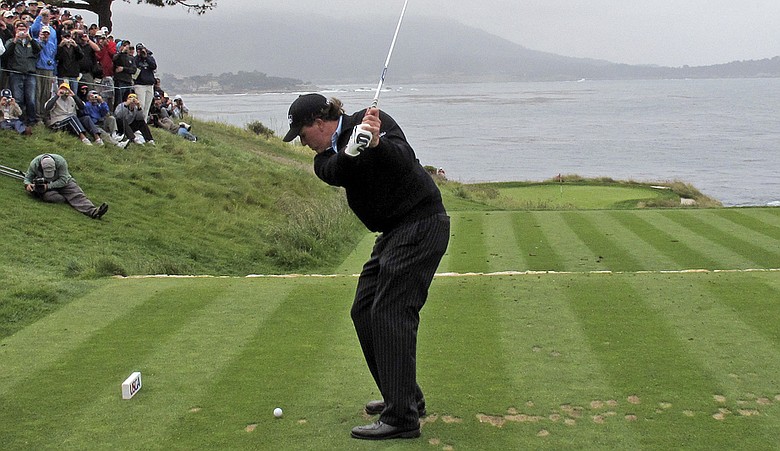 Phil Mickelson tees off on the par-3 seventh hole on June 15.