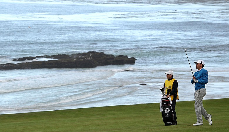 Rafael Cabrera-Bello hits his approach into the 10th hole Thursday at Pebble Beach.