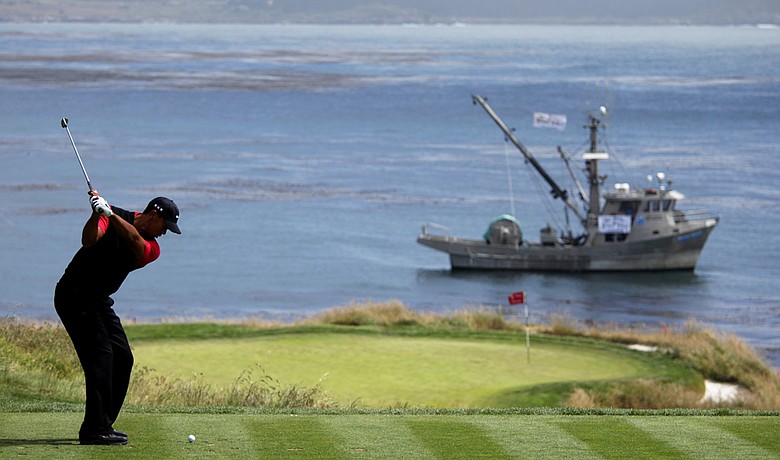 Tiger Woods hits to the seventh green during the final round of the U.S. Open.