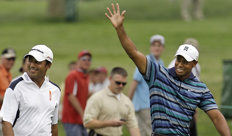 Tiger Woods (right) and Arjun Atwal play a practice round at the AT&T National on June 29.
