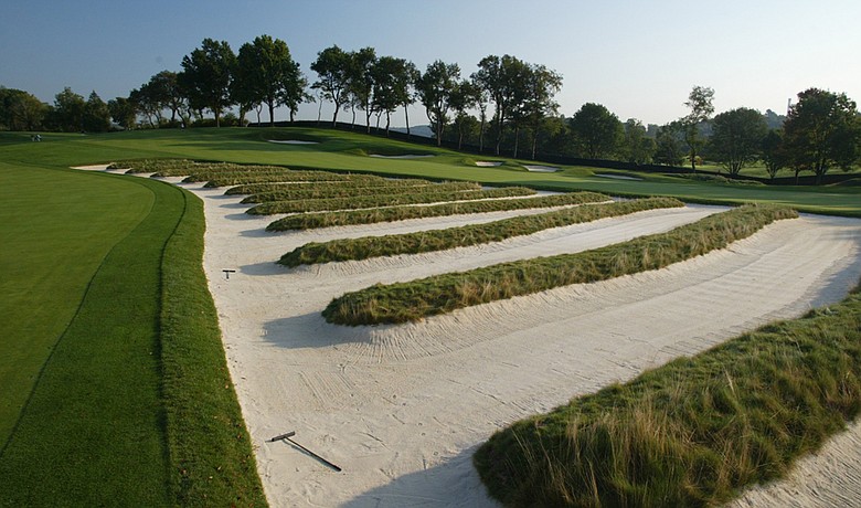 The church pew bunkes on the third hole at Oakmont Country Club.