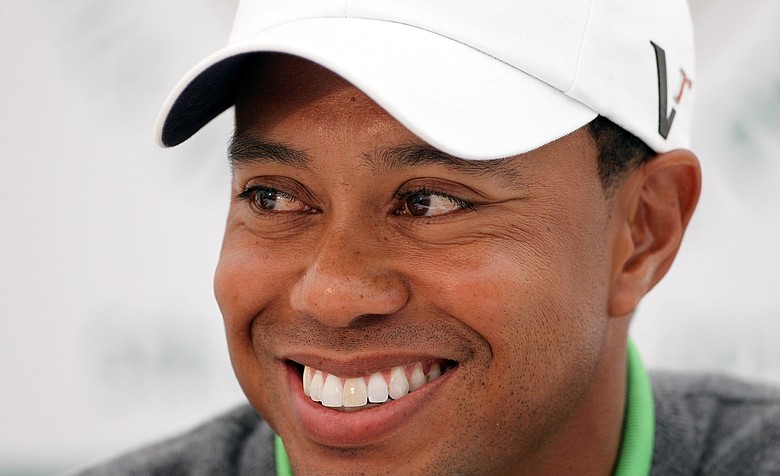 Tiger Woods smiles during a press conference after playing in the JP McManus Invitational Pro-Am.