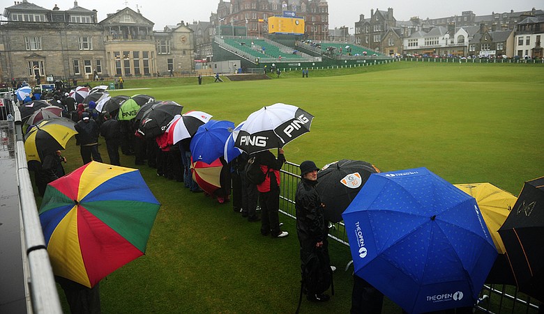 Spectators look out near Nos. 1 and 18 at the Old Course at St. Andrews.