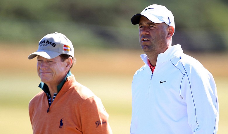 Tom Watson and Stewart Cink look on during a practice round on the Old Course at St. Andrews.
