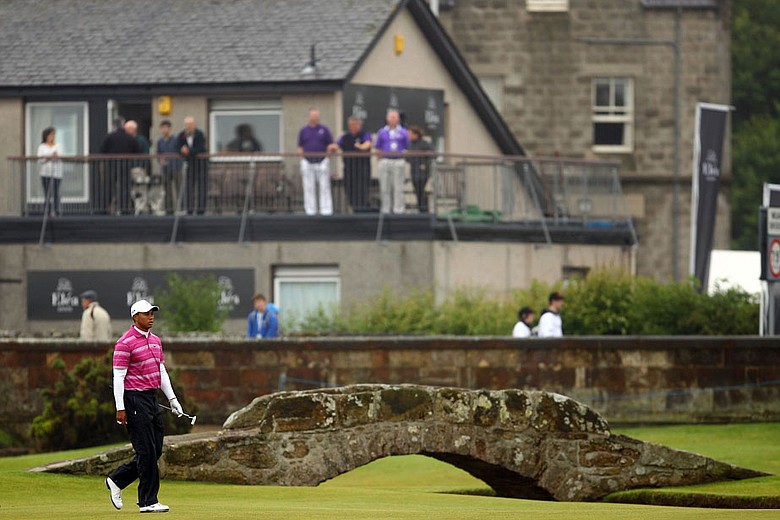 Tiger Woods walks on the first hole during the first round of the British Open.