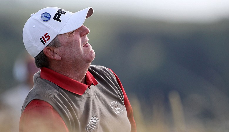 Mark Calcavecchia watches an approach shot during the third round of the British Open.