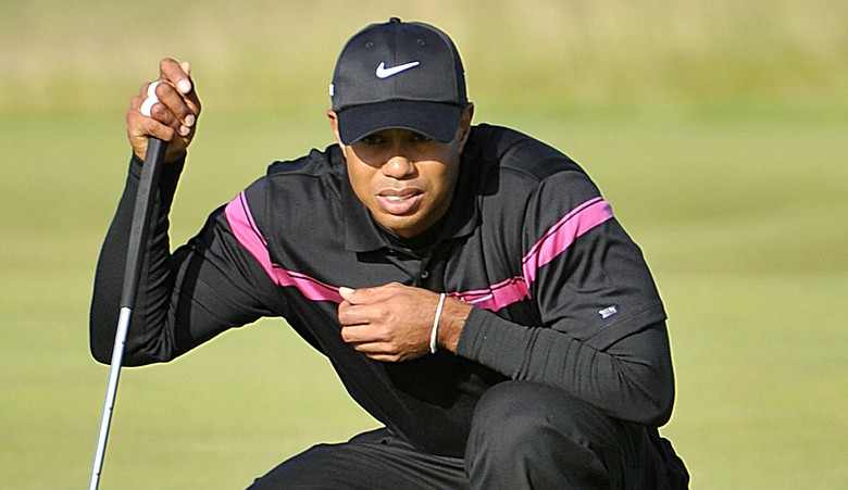 Tiger Woods reads a putt during Round 3 of the British Open.