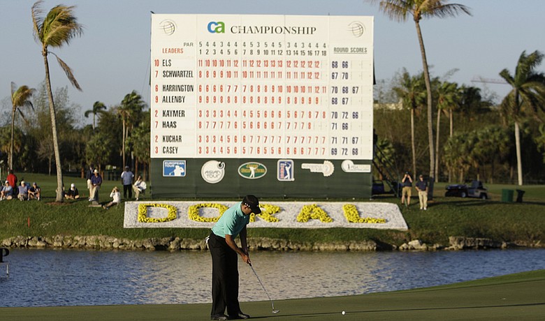 Charl Schwartzel putts on the 18th green during the third round of the CA Championship in Doral, Fla.