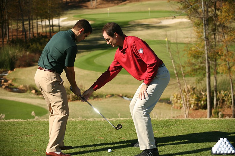 Charlie King (right) is the director of the Reynolds Plantation Golf Academy in Greensboro, Ga.