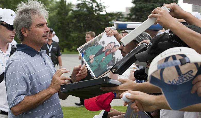 Fred Couples signs autographs at the U.S. Senior Open.