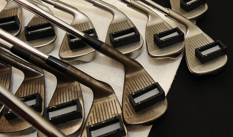 The USGA tests clubs for conforming grooves before the 2009 Children's Miracle Network Classic.