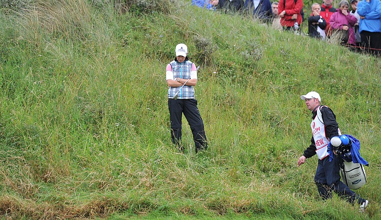 Defending champion Catriona Matthew looks at an unplayable lie at the 13th hole at Royal Birkdale.