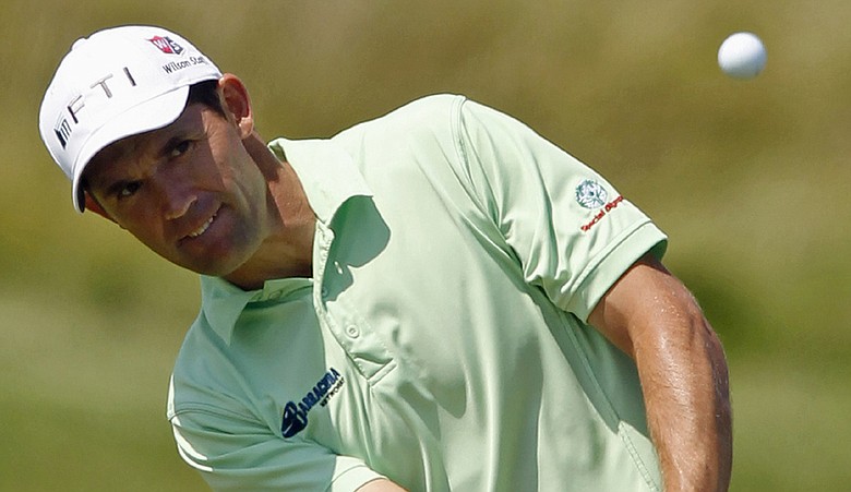 Padraig Harrington of Ireland chips up to the 16th green during the first round of the PGA Championship.