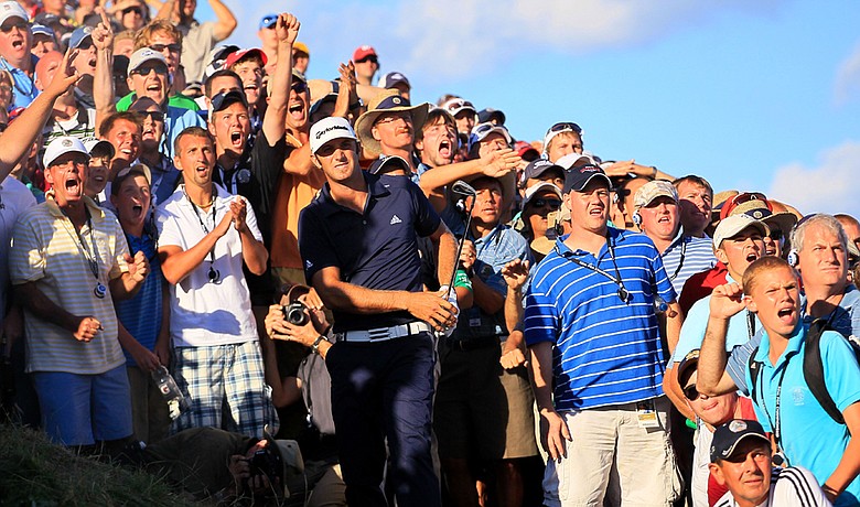 Dustin Johnson hits from a bunker on the 18th hole at Whistling Straits during the final round of the PGA Championship.