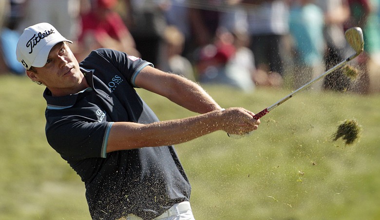 Nick Watney hits a shot on the 10th hole during the final round of the PGA Championship.