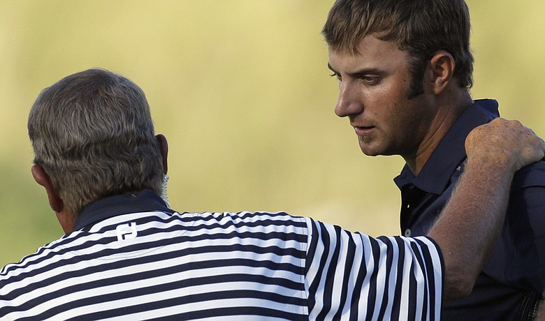 Dustin Johnson talks with rules official David Price on the 18th hole during the final round of the PGA Championship.