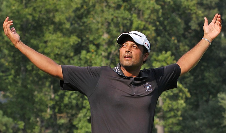 Arjun Atwal celebrates after winning the Wyndham Championship.