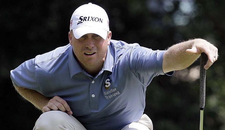 John Rollins reads a putt during the Wyndham Championship.