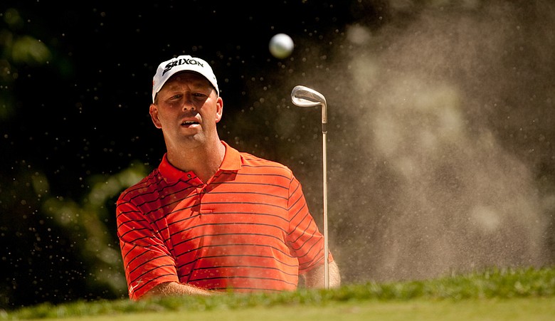 Mike Small follows through on a bunker shot during the second round of the John Deere Classic.