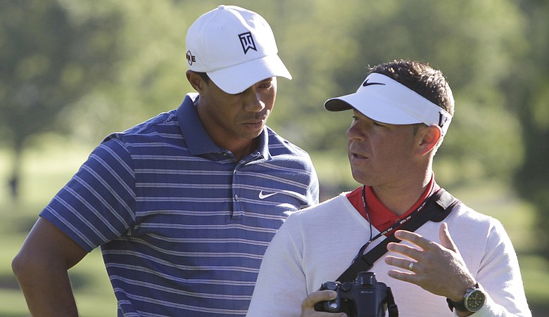 Tiger Woods and swing coach Sean Foley work together at the BMW Championship.