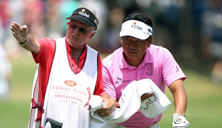 K.J. Choi chats with his caddie Andy Prodger during the third round of the 2010 Crowne Plaza Invitational.