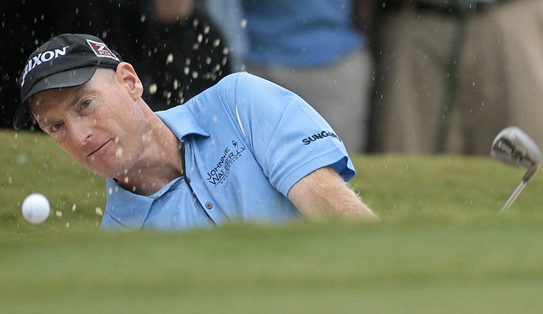 Jim Furyk blasts out of a bunker on the par-3 18th hole during the final round of the 2010 Tour Championship.