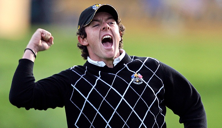 Rory McIlroy celebrates his putt on the 17th green.