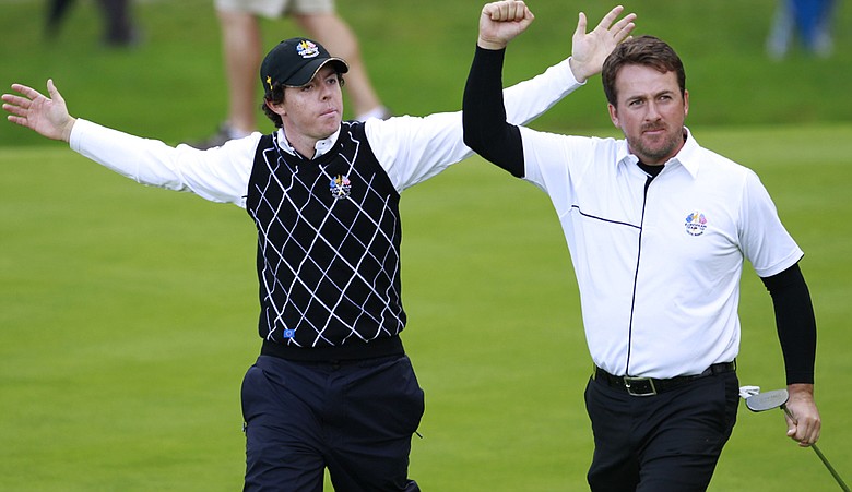 Rory McIlroy and Graeme McDowell celebrate during their third straight team match at the Ryder Cup.