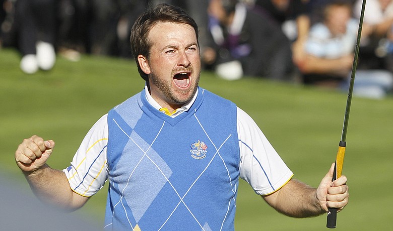 Graeme McDowell celebrates after making a birdie putt on No. 16 during Monday singles.