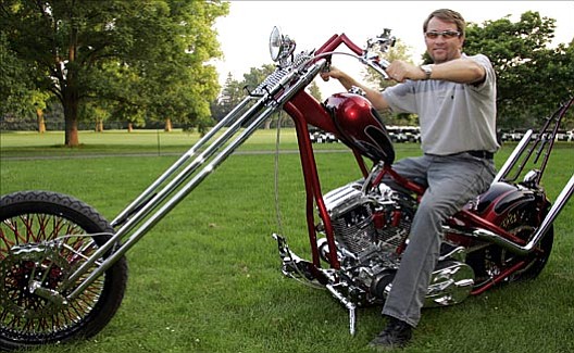 Davis Love III is giving up his prized Orange County Chopper to raise money for charity.