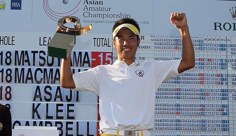 Hideki Matsuyama of Japan stands with the trophy after winning the 2010 Asian Amateur Championship at Kasumigaseki Country Club.