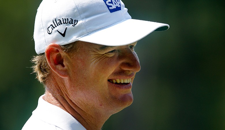 Ernie Els smiles while on the practice range prior to playing his first round of the Tour Championship.