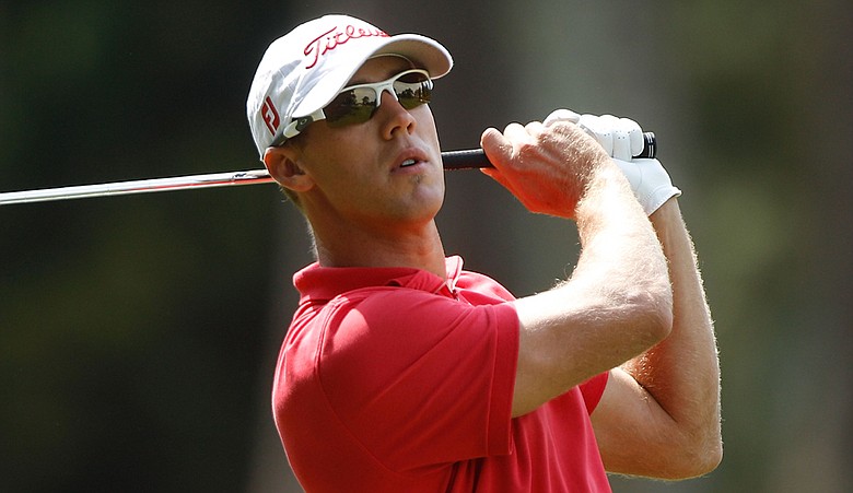 Graham DeLaet watches his approach shot on the ninth hole during the final round of the 2010 Verizon Heritage.