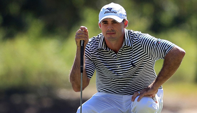 Jonathan Byrd lines up a putt through leaves during the first round of the 2010 Viking Classic.
