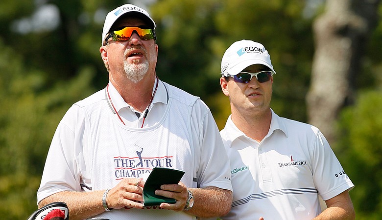 Zach Johnson, right, looks on with caddie Damon Green from the second tee during the first round of The Tour Championship.
