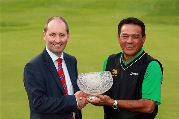 Andy Stubbs, managing director of the European Senior Tour, presents the John Jacobs Trophy to Boonchu Ruangkit of Thailand for being the top money earner in 2010.