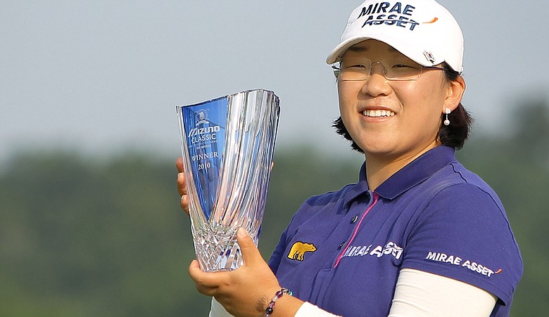 Jiyai Shin poses with the winner's trophy during an award ceremony after winning the Mizuno Classic at Kintetsu Kashikojima Country Club.