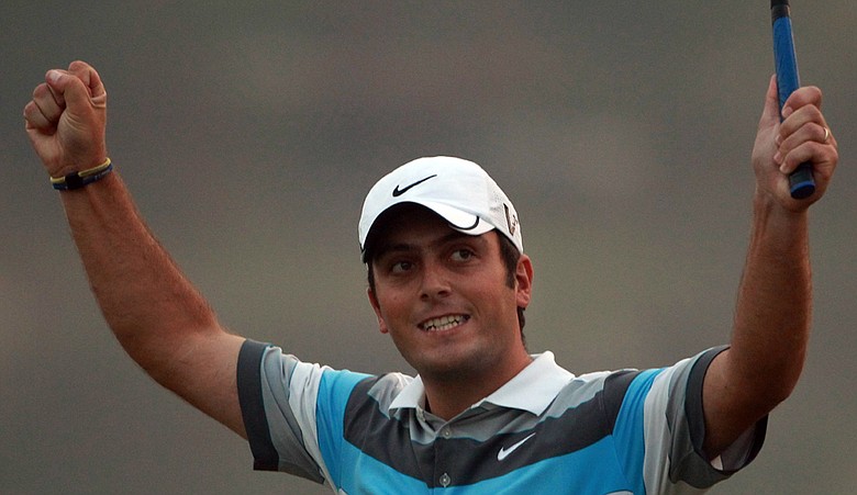 Francesco Molinari celebrates on the 18th green after winning the WGC-HSBC Champions.