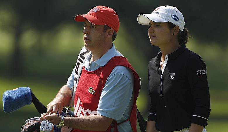 Lorena Ochoa (right) with husband and caddie Andres Conesa
