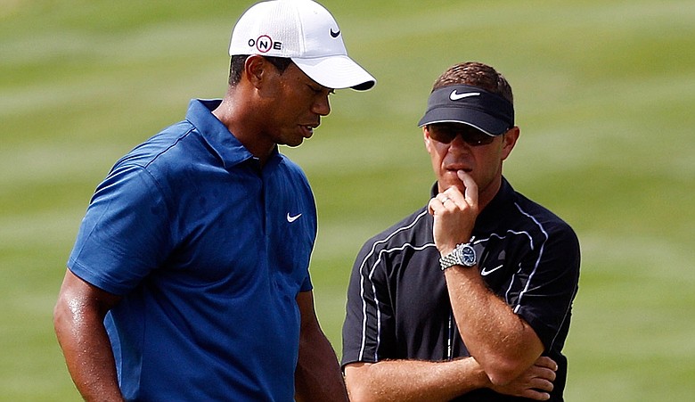 Sean Foley talks with Tiger Woods at the 2010 PGA Championship.