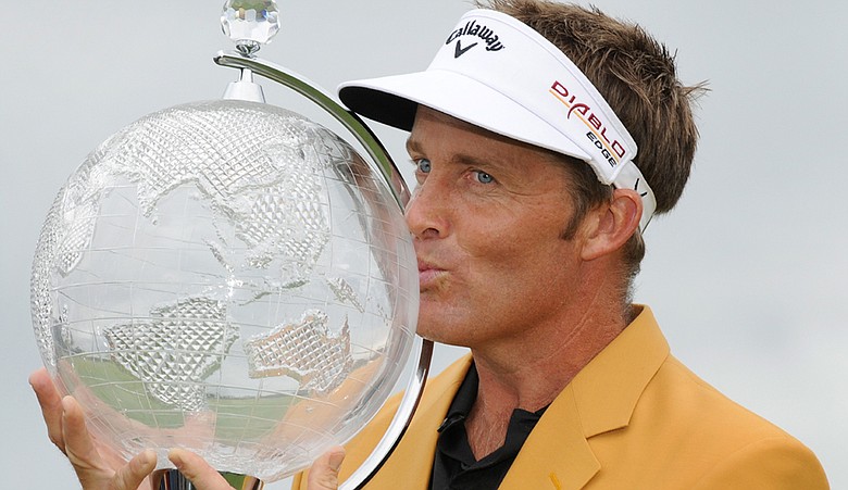 Stuart Appleby holds the trophy after winning the Australian Masters at the Victoria Golf Club in Melbourne.