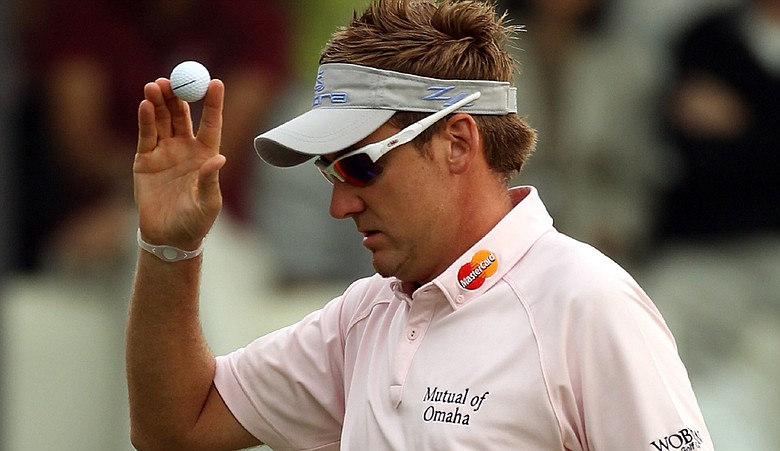 Ian Poulter of England celebrates on the 18th green during Day 3 of the UBS Hong Kong Open.